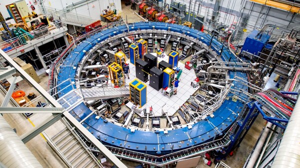 <noautolink>The muon g-2 ring sits in its detector hall amidst electronics racks,</noautolink>